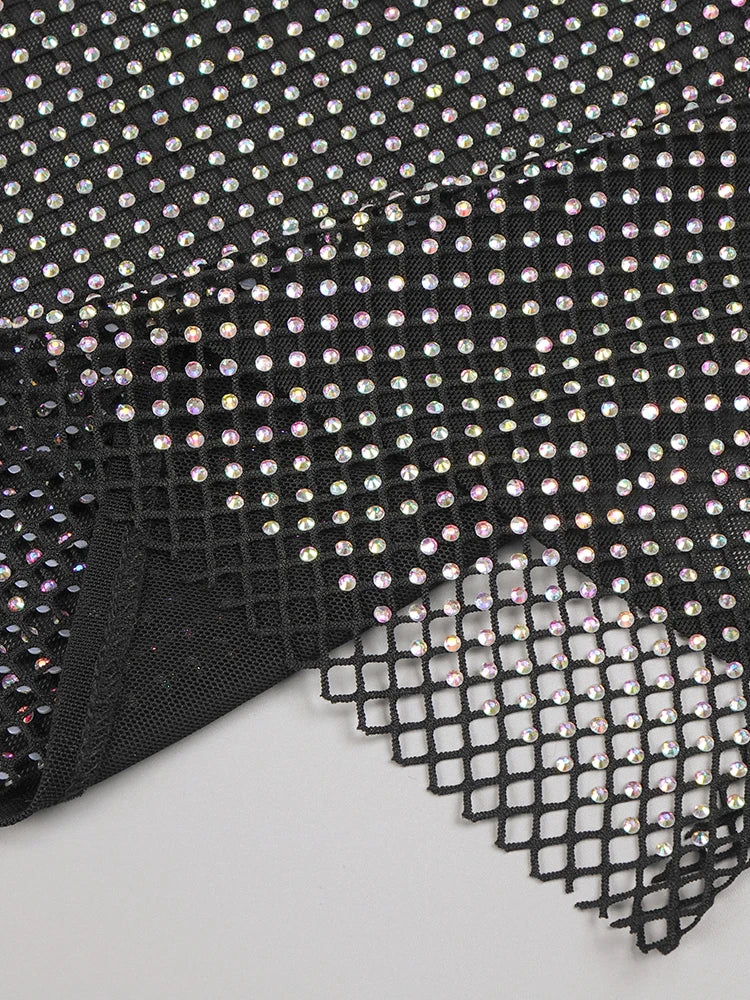 Black mesh fabric with small rhinestones on a white background