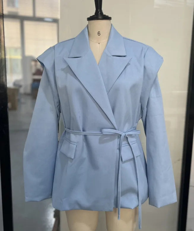 Light blue blazer on a mannequin against a neutral background