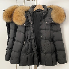 Black puffer jacket with fur-lined hood on a hanger