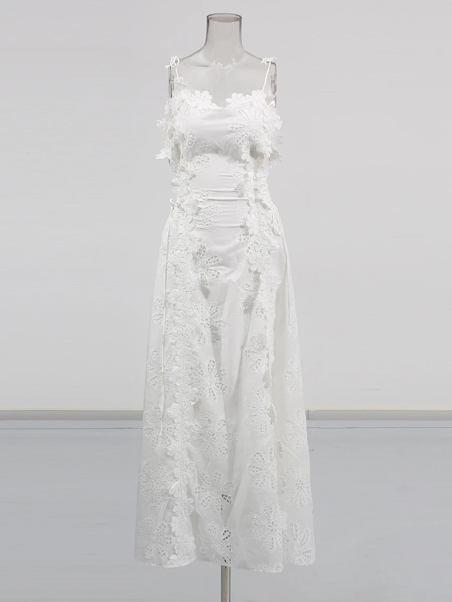 White lace dress on a mannequin against a gray background