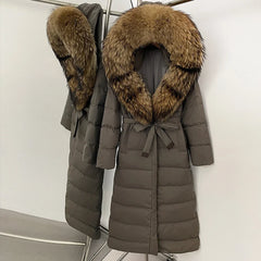 Two brown puffer coats with fur collars on a white background