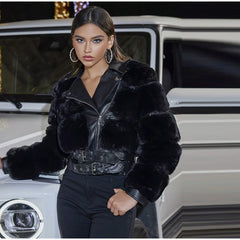 Woman wearing a black fur jacket in front of a car
