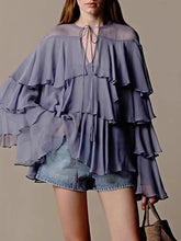 Tiered ruffle long sleeve blouse with a loose-flowing silhouette