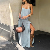 Maxi dress with spaghetti straps, gathered empire waist, and thigh-high slit