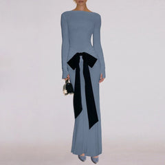 Long-sleeve blue dress with a black bow detail