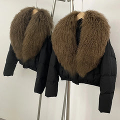 Black cropped puffer jacket with a large brown fur collar.