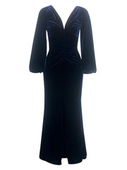 Black velvet dress with long sleeves on a white background