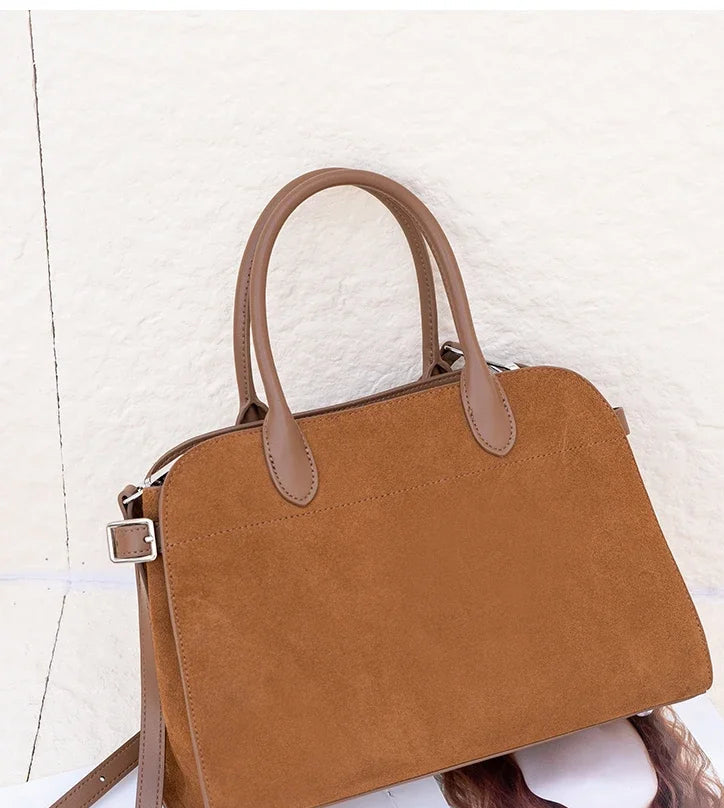 Brown handbag on a white background