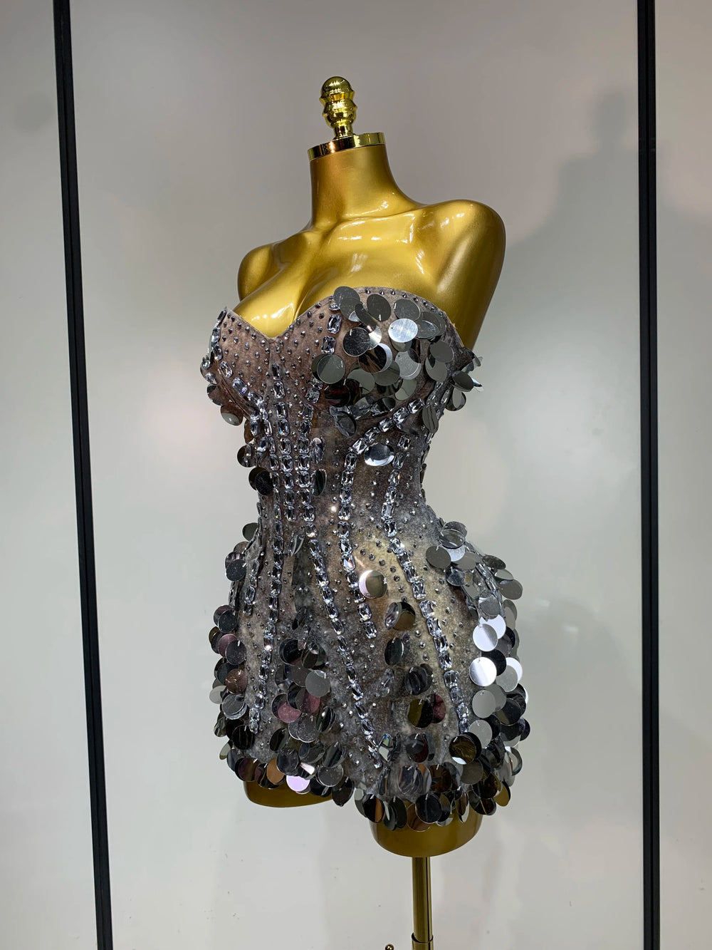 Sequined strapless mini dress side view