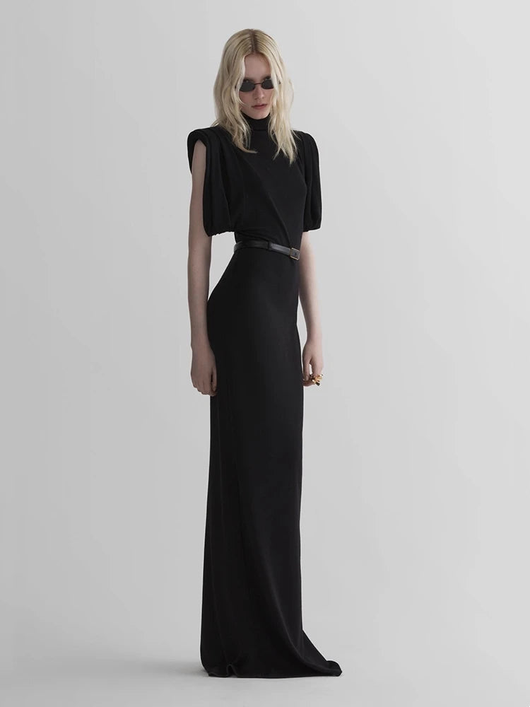 Black turtleneck padded shoulder maxi dress side view