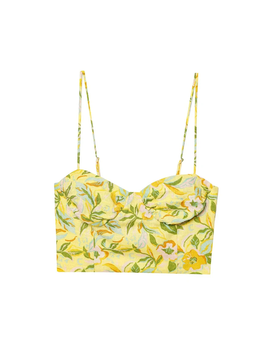 Yellow floral crop top with thin straps on a white background