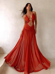 Woman wearing a red evening gown with a plain background