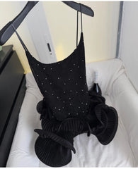 Rhinestone embellished wavy ruffled mini dress on hanger detail.