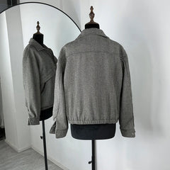Gray textured jacket displayed on a mannequin against a white background