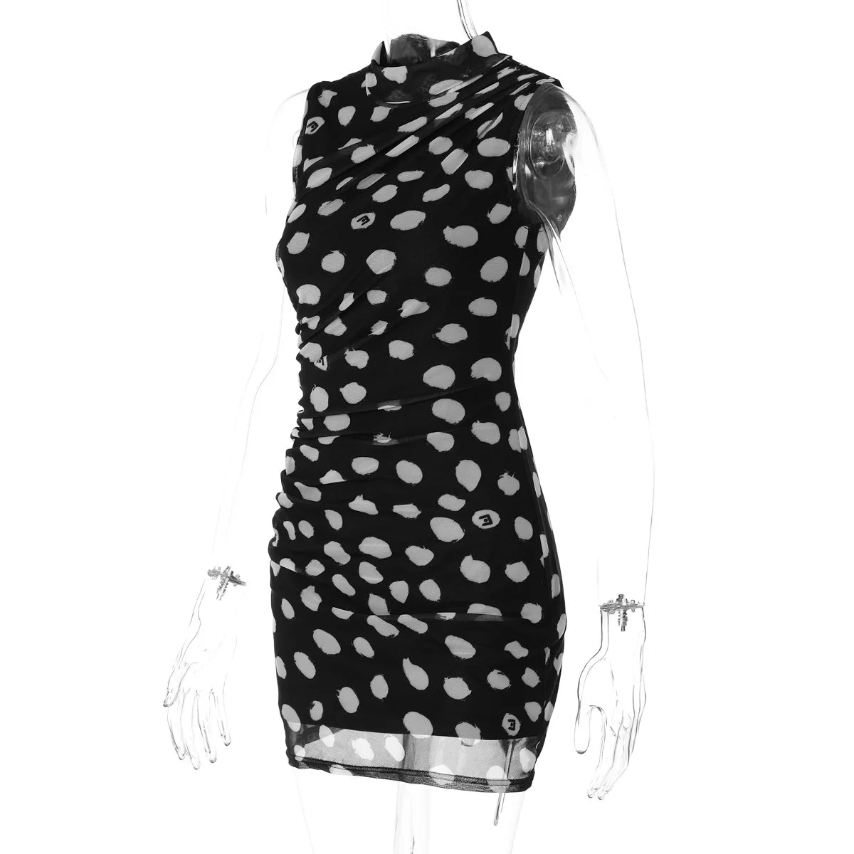 Black dress with white polka dot pattern on a mannequin