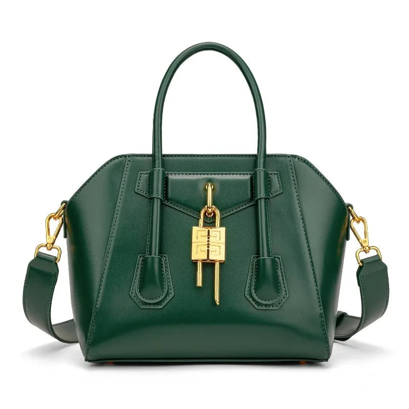 Green leather structured lock bag on a white background
