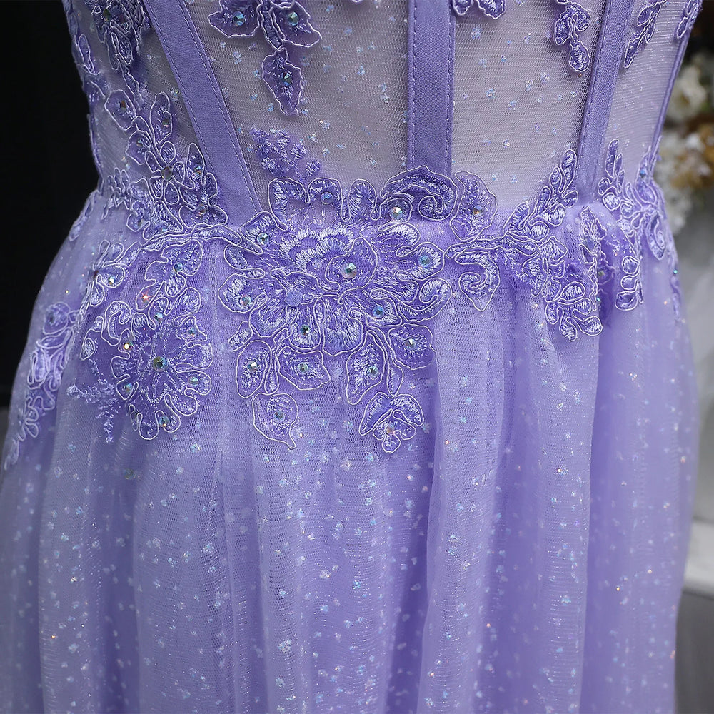 Close-up of a purple dress with intricate lace and bead detailing.