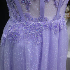 Close-up of a purple dress with intricate lace and bead detailing.
