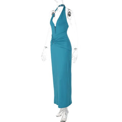 Teal evening gown on a mannequin against a white background