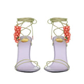 Purple stiletto sandals with coral grape bead embellishments and ankle wrap straps