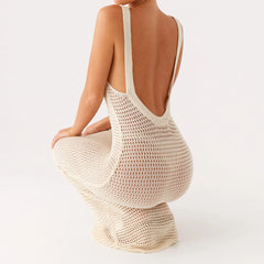 Beige crochet dress with open back on a white background