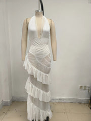 White dress on a mannequin against a plain background