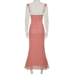Red and white checkered dress on a mannequin against a white background