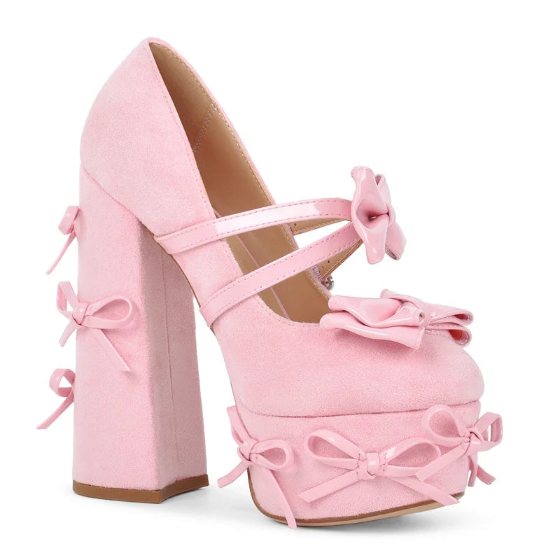 Close-up of the strap and platform detail on pink Mary Jane heels.