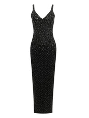 Black dress with white polka dot pattern on a white background