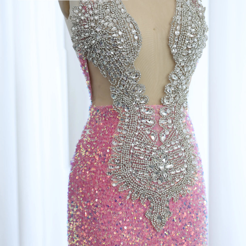 Pink dress with silver beading on a mannequin against a white background