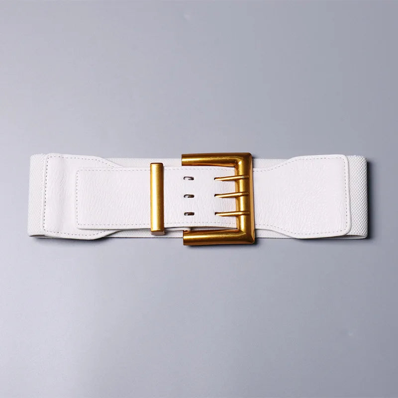 White belt with a gold buckle on a gray background