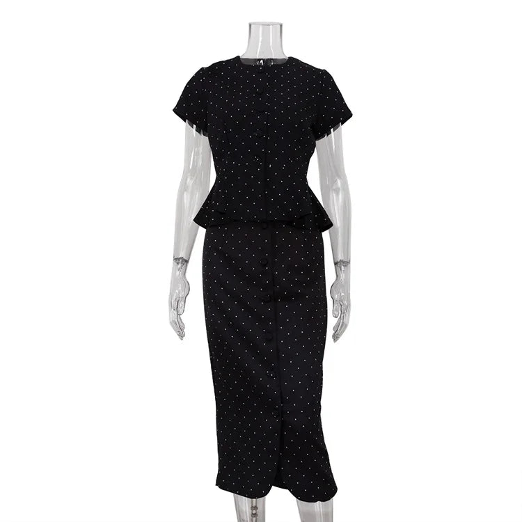 Black polka dot dress on a mannequin