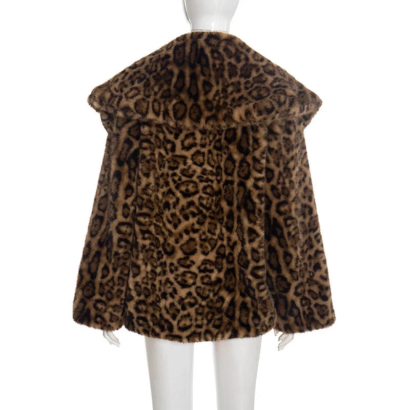 Leopard print fur coat on a mannequin against a white background