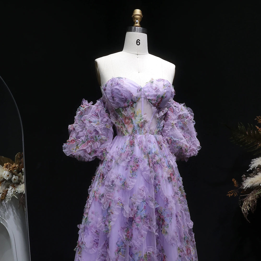 Purple floral dress on a mannequin against a black background