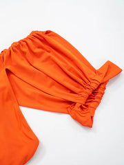 Orange fabric with a knot on a white background