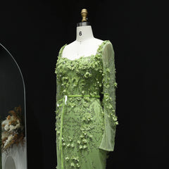 Green floral dress on a mannequin against a black background