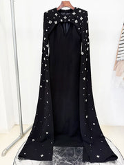 Black maxi dress with beaded cape sleeves on a hanger