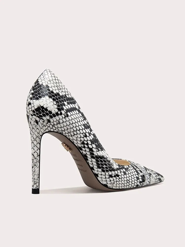 High-heeled shoe with snake print on a light background