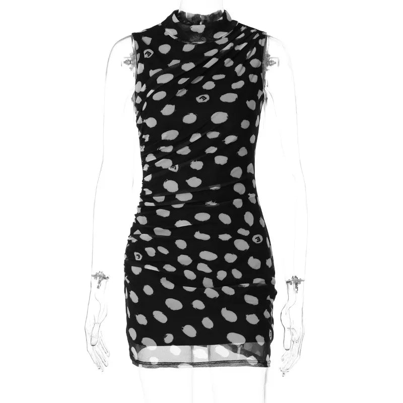 Black dress with white polka dot pattern on a mannequin