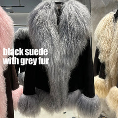 Black suede coat with grey fur trim on a mannequin in a store setting.
