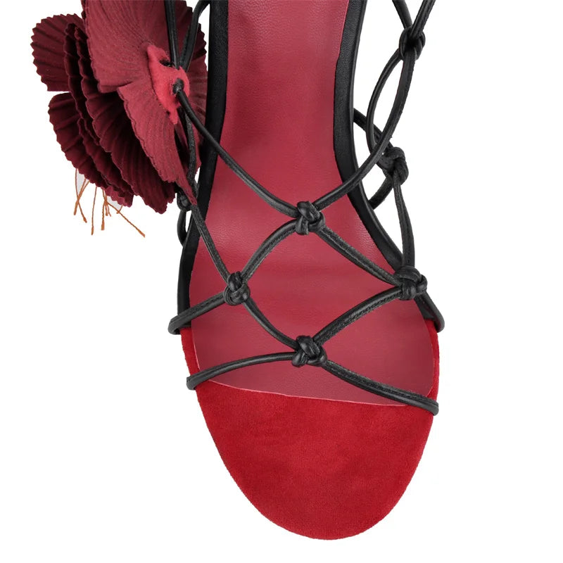 Close-up of the knotted straps and floral detail on stiletto sandals