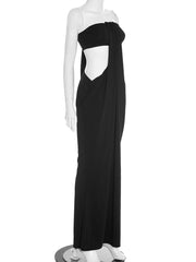 Black evening gown on a mannequin against a white background