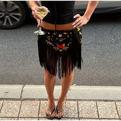 Black floral embroidered mini skirt with fringe