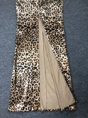 Leopard print scarf with a beige center on a blue textured background