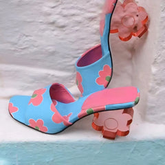 Blue floral print mule with a pink sole and clear acrylic flower heel