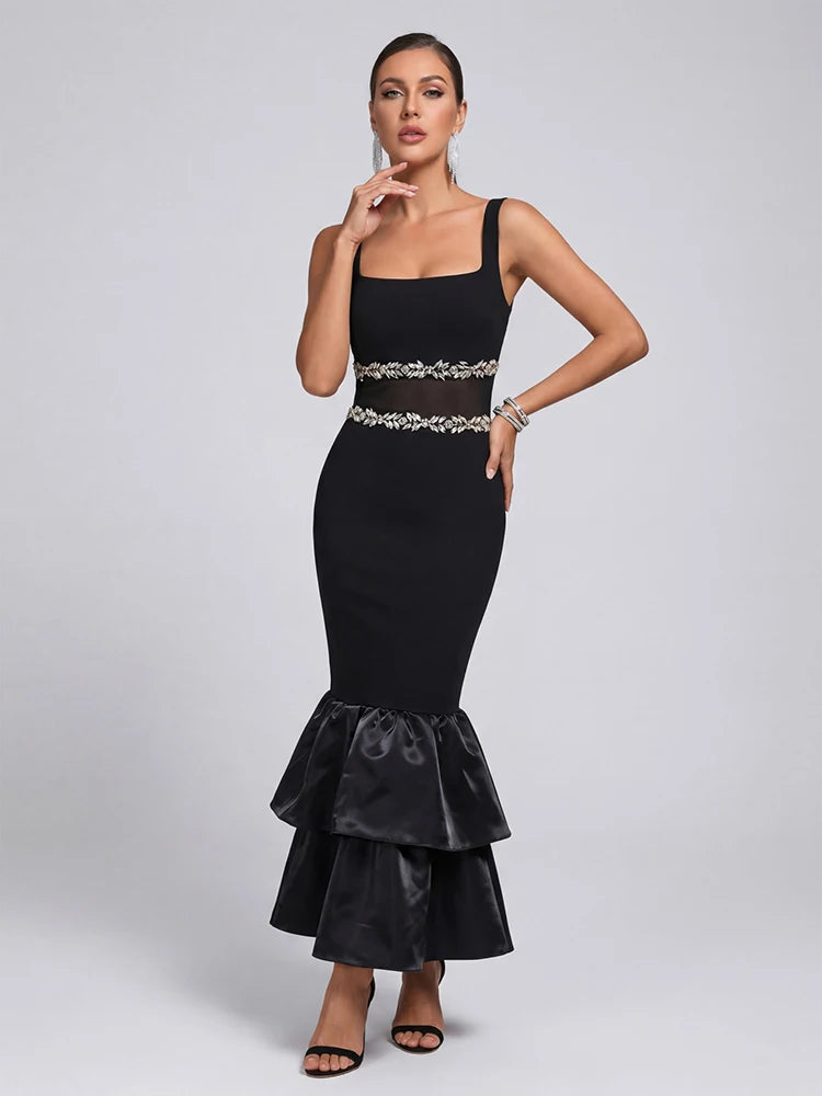 Back view of a black square neck midi dress with a ruffled hem.
