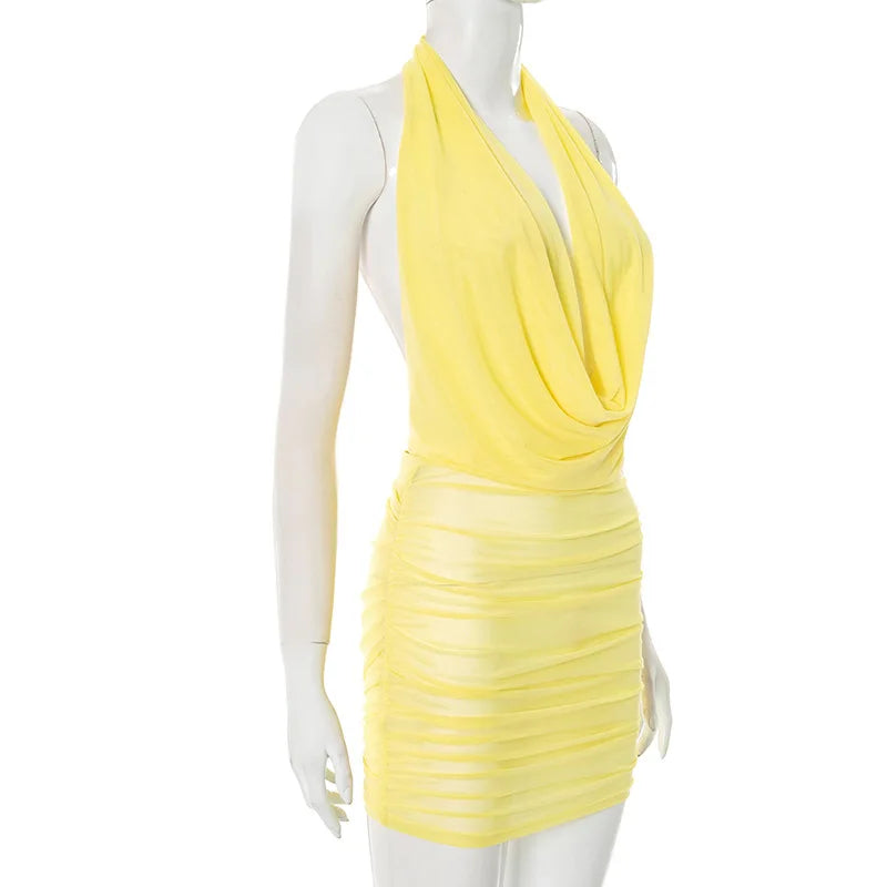Yellow dress on a mannequin against a white background