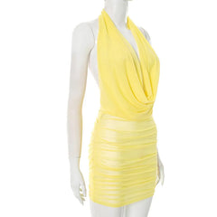 Yellow dress on a mannequin against a white background