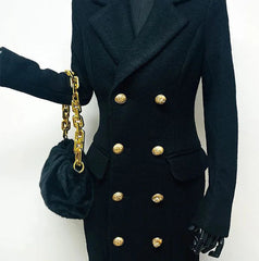Black coat with gold buttons and black gloves on a white background
