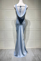 Sleevless gown with a high slit on a mannequin against a neutral background